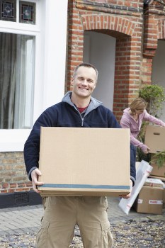 Furniture pick-up team handling bulky items in a Barnet home