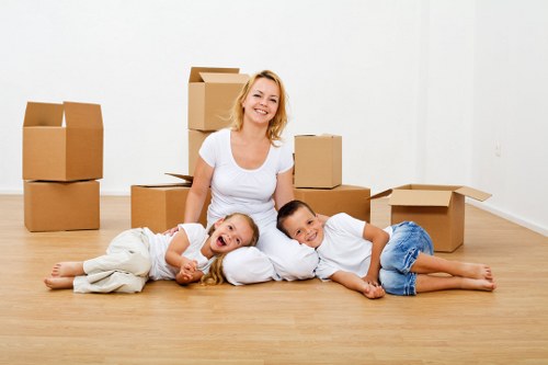 Packed moving boxes and furniture ready for local removal service